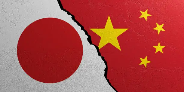 Photo of Japan and China flag, plastered wall background. 3d illustration