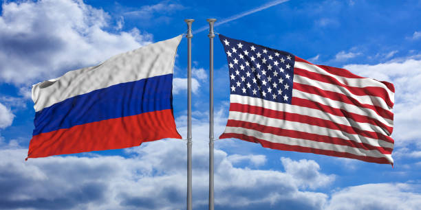 istock Russia and USA flags on blue sky background. 3d illustration 1024730570