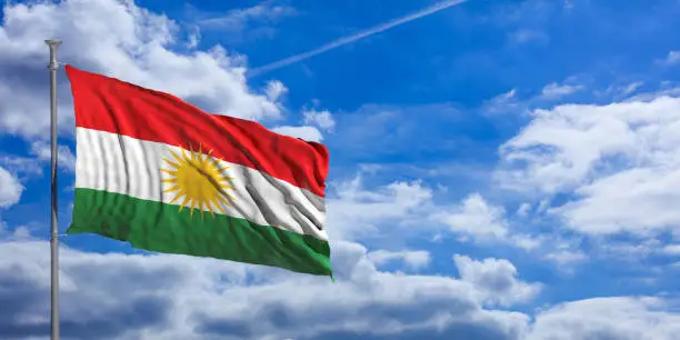 Kurdistan flag waves proudly under a blue sky with many white clouds. 3d illustration