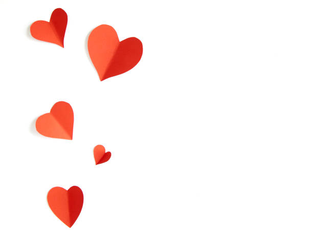 istock Red paper hearts on white background 1024734882