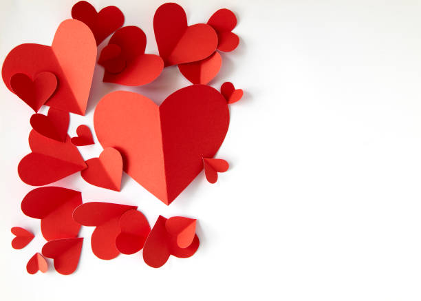 istock Red paper hearts on white background 1024734916