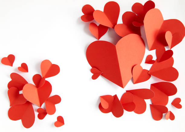 istock Red paper hearts on white background 1024734950