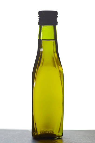 istock A green bottle filled with  Olive oil 1024734956