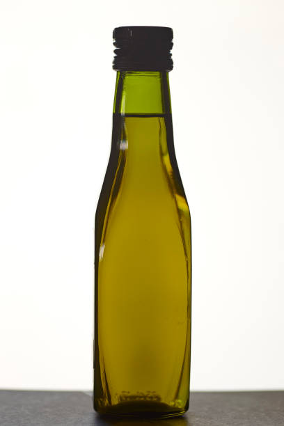 istock A green bottle filled with  Olive oil 1024734976