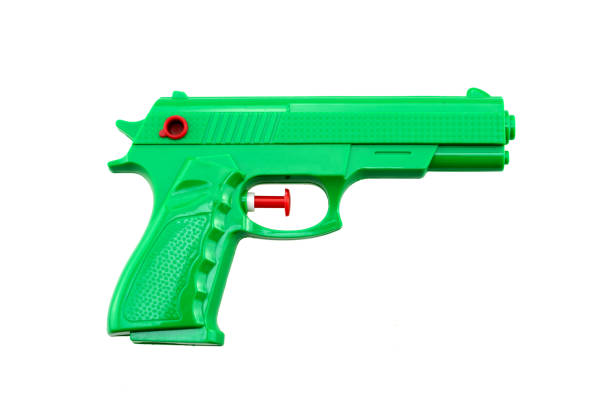 istock green plastic water toy gun shaped like a real one on white background 1024737486
