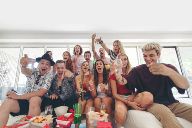 istock Group of Friends watching sport on TV 1024738430