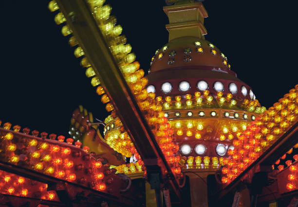 istock Close-up of old amusement park lights on black background 1024744240