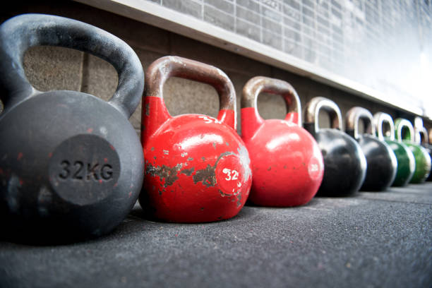 istock Row Of Kettlebells Against Wall At Gym 1024752522