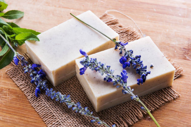 istock Handmade soap bars with lavender flowers on table 1024770826