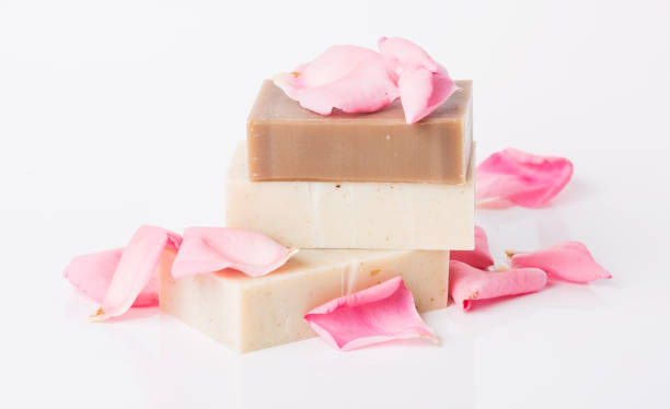 istock Handmade soap with flower petals on white background 1024770872