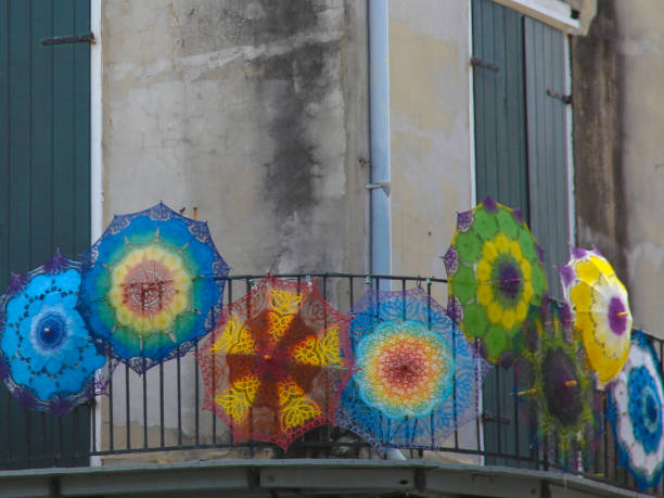 istock Colorful Umbrellas on Old Stone Building Facade 1024774572
