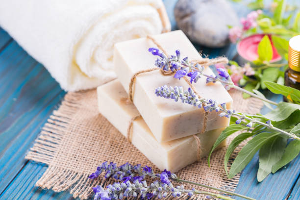 istock Handmade soap bars with lavender flowers on table 1024776276