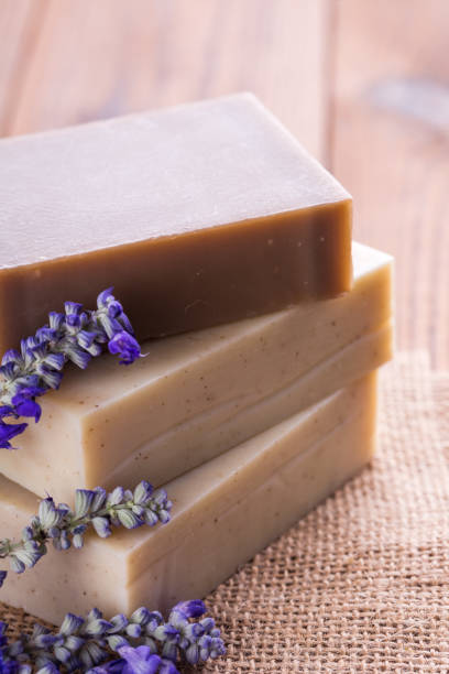istock Handmade soap bars with lavender flowers on wooden table 1024776620