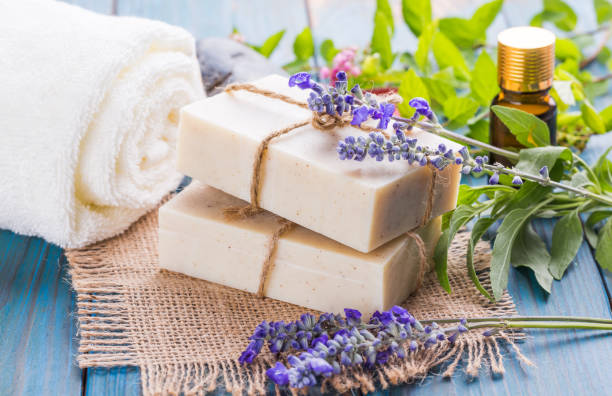 istock Handmade soap bars with lavender flowers on table 1024776638