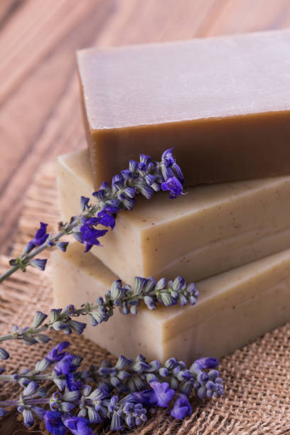 istock Handmade soap bars with lavender flowers on wooden table 1024776738