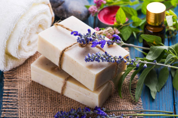 istock Handmade soap bars with lavender flowers on table 1024776746