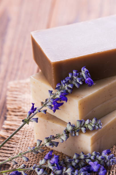 istock Handmade soap bars with lavender flowers on wooden table 1024776796