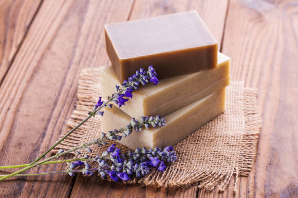 istock Handmade soap bars with lavender flowers on wooden table 1024777112