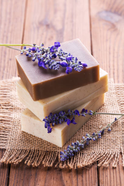 istock Handmade soap bars with lavender flowers on wooden table 1024777606