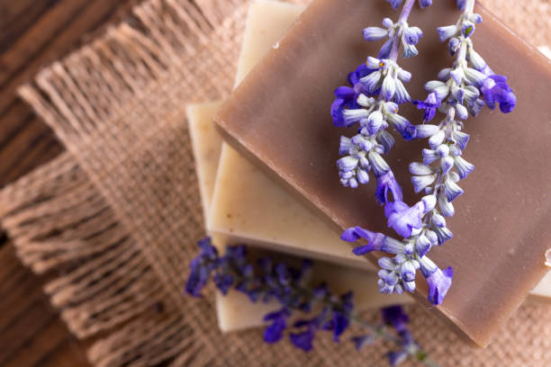 istock Handmade soap bars with lavender flowers on wooden table 1024778882