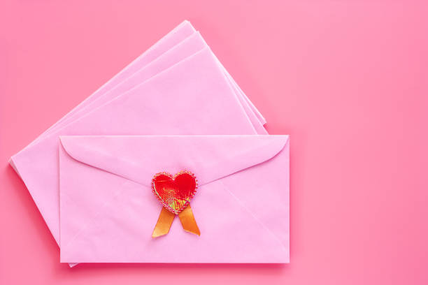 istock Pink envelope with red heart on pink background for Valentine's day and love concept 1024779682