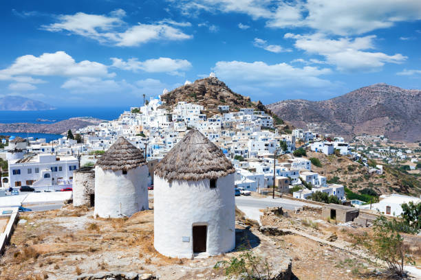 istock Old windmills over the town of Ios island 1024794266
