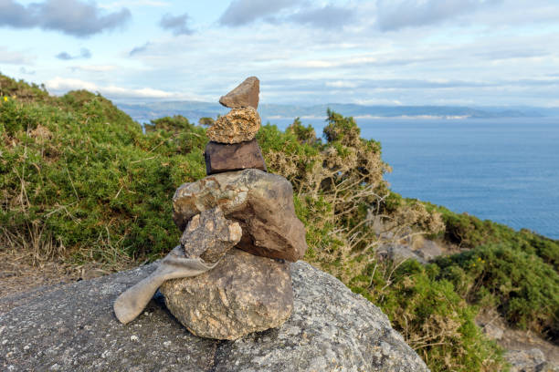 istock stones on the shore built up by a pyramid 1024794408