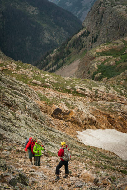 istock Seniors hiking challenging rocky terrain 1024794964