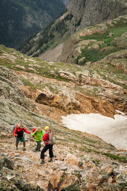 istock Seniors hiking challenging rocky terrain 1024794982