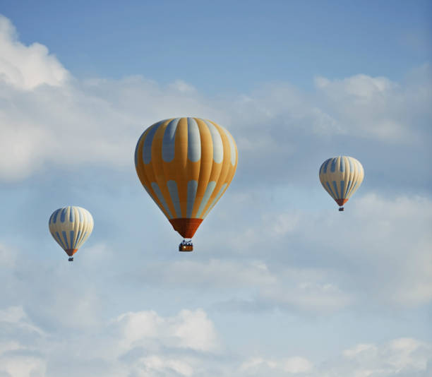 istock Three hot air balloons flying in the sky 1024805384