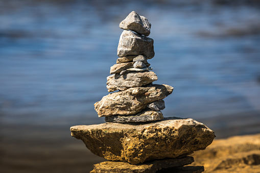 Inukshuk by the river edge.