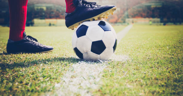 istock Low Section Of Man Playing Soccer On Field 1024809372