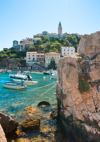 Old town Vrbnik, Croatia, bay with boats and clear water