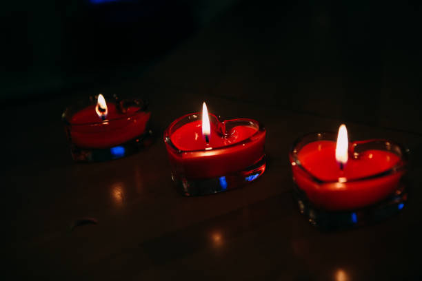 istock three candles in the form of a heart burn 1024825476