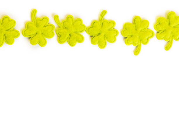 istock St Patricks Day side border of cloth shamrocks isolated on white 1024828402