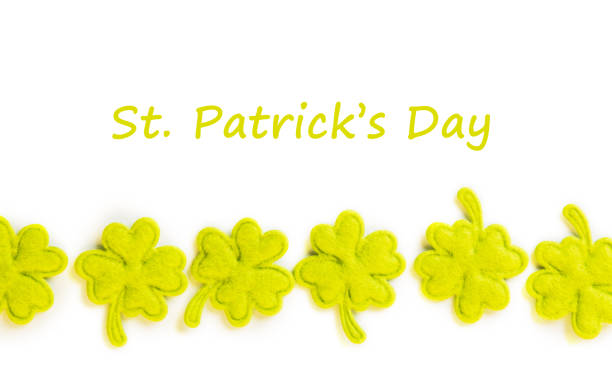 istock St Patricks Day side border of cloth shamrocks isolated on white 1024828480