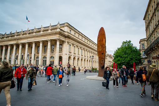 Bordeaux, France - May 02, 2018: Place de la Comedie and Bordeaux Grand Theatre, France.  Sculpture is by Jaume Plensa, named \