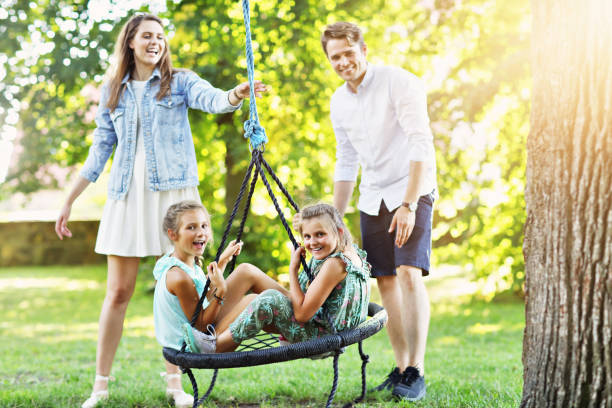 istock Joyful family having fun on playground 1024828834