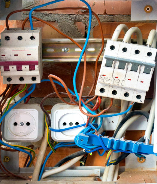 istock Electrical box with violations. Fractured wires. Dangerous situation 1024829664