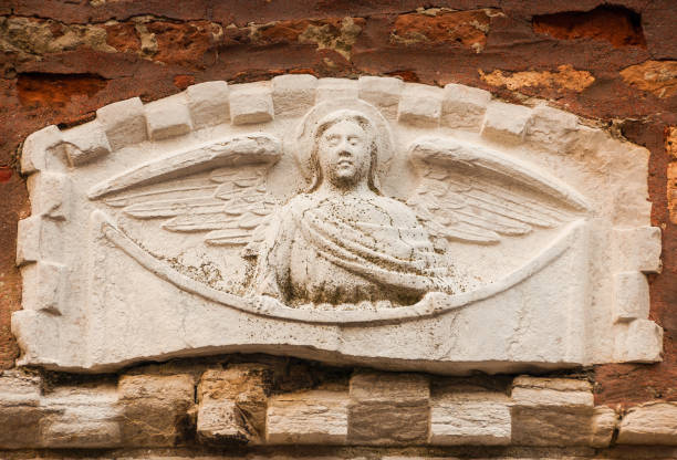 Ancient stone relief of an angel on a Venice wall