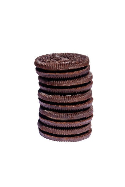 istock Stack of chocolate cookies with cream filling isolated on white background 1024843472