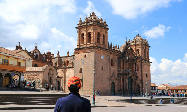 istock Young Tourist Admiring the Marvelous Cusco Cathedral on Plaza de Armas, Cusco, Peru, South America 1024843716