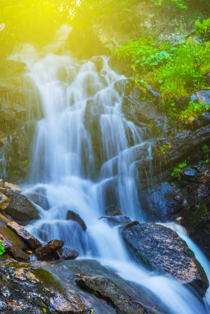 istock closeup beautiful waterfall on the mountain river 1024863676
