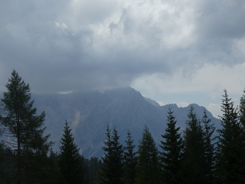 clouds sky fog summit rock panorama landscape mounains south tyrol italy europe forest meadow green grass tree