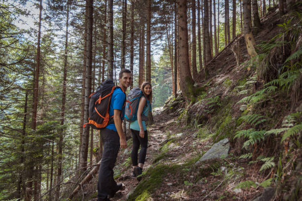 istock strong couple hiking in the mountains 1024870058