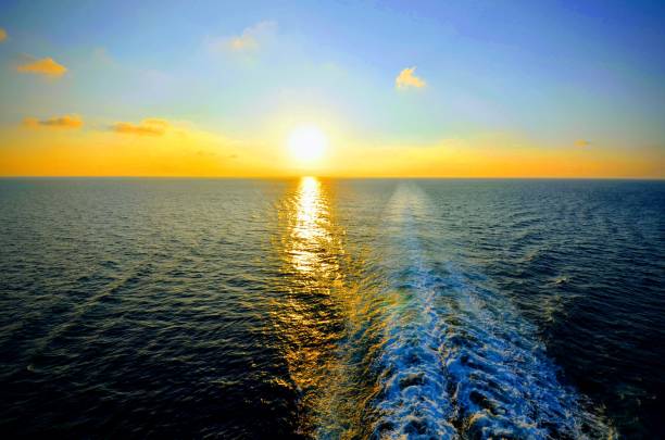 istock Sunrise and Cruise Ship Water Trace 1024870288