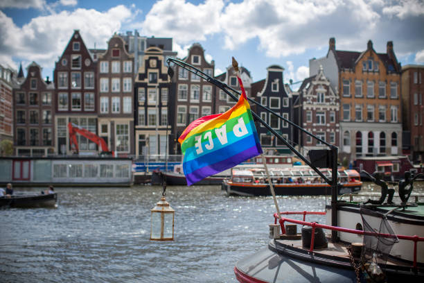 istock Traditional dutch buildings on canal in Amsterdam 1024870636