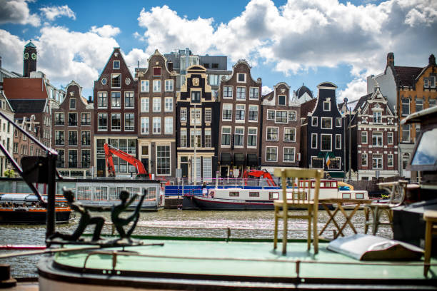 istock Traditional dutch buildings on canal in Amsterdam 1024870670