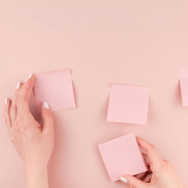 istock Woman hands with paper stickers 1024897500