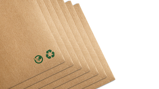 Eco packaging isolated on white background. Recycling paper bag brown shopping, that do not cause harm to the environment. Recycling and ecology sign. Ecologic craft package.